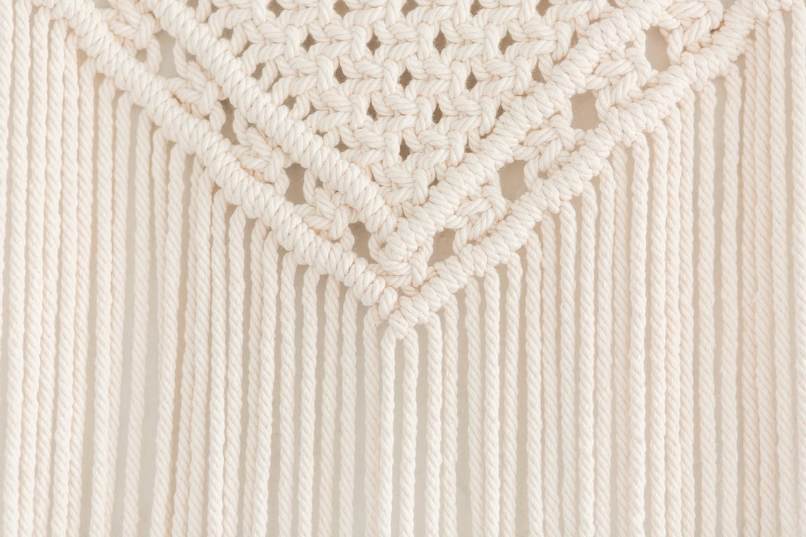 Close up of handmade macrame panel. Texture. Background.